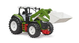 Bruder Roadmax tractor with green body, raised white front loader bucket, red chassis details and large tread tyres on a white background.