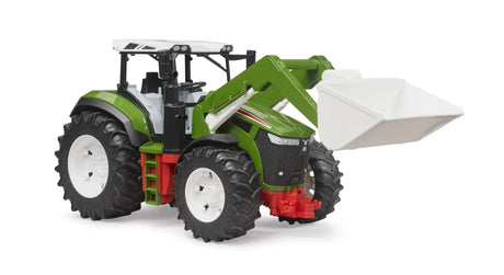 Bruder Roadmax tractor with green body, raised white front loader bucket, red chassis details and large tread tyres on a white background.