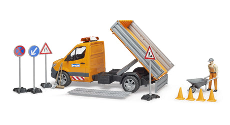 A Mercedes Benz Sprinter municipal toy truck with its tipping bed raised, ramps on the ground and a construction worker with accessories.