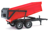 Red Bruder tipping trailer toy with a black frame and its trailer bed lifted upward