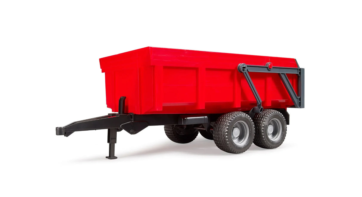 Red Bruder tipping trailer toy with a black frame and its trailer bed lowered and closed