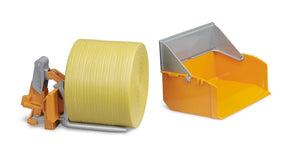 Bruder bale forks attachment in orange and grey holding a single yellow round bale on metal arms