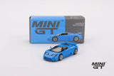 Bugatti EB110 Super Sport model displayed in front of its Mini GT box with Blu Bugatti bodywork and silver wheels visible