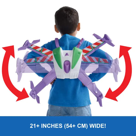 Rear view of a child wearing the Buzz Lightyear jetpack with arrows showing the wings moving into position