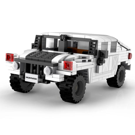 Front angled view of CaDA Humvee Off Road Truck model in white with black grille and red headlights