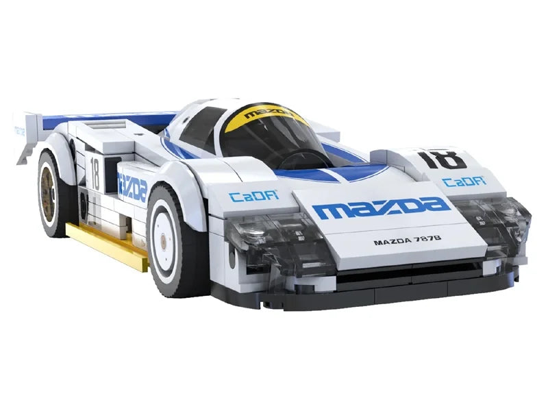 Front angled view of CaDA Mazda 787B brick model in white and blue with number 18 and aerodynamic body shape