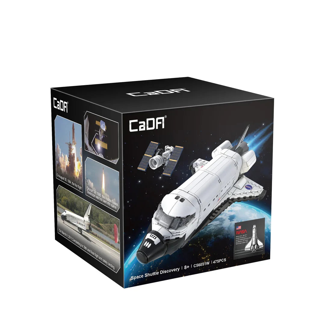 CaDA Space Shuttle Discovery packaging box featuring NASA shuttle model and satellite artwork against space background