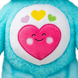 Close-up of the colourful heart belly badge on Care Bears Always Here Bear.
