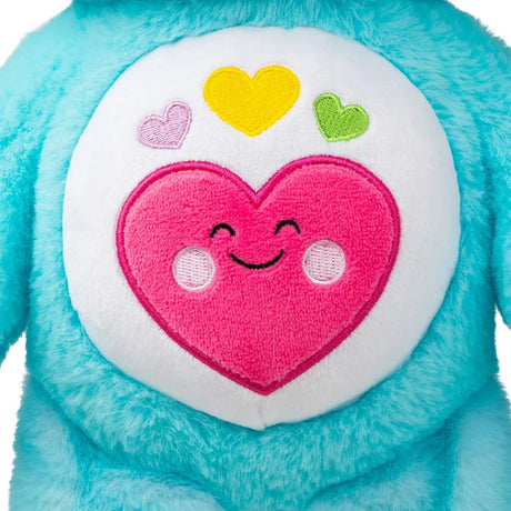 Close-up of the colourful heart belly badge on Care Bears Always Here Bear.