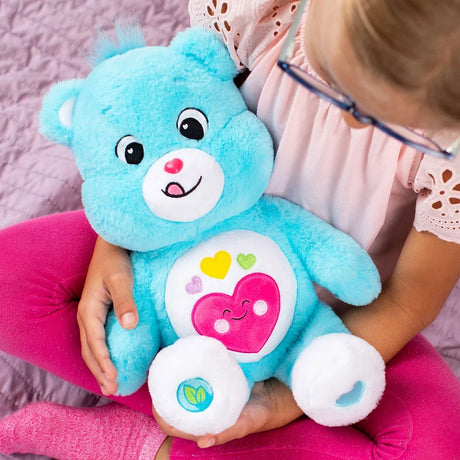 Care Bears Always Here Bear blue plush displayed in a lifestyle photograph.