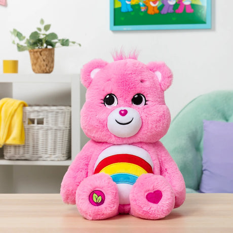 Care Bears Cheer Bear eco-friendly plush displayed on a table in a colourful playroom in Ireland.