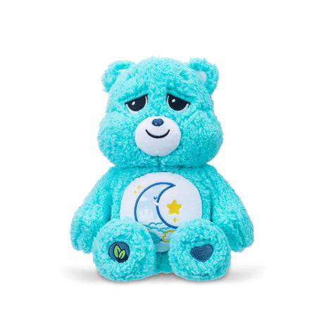 Front view of Care Bears Cozy Bedtime Bear 14″ plush with sleepy moon and star belly badge in Ireland.