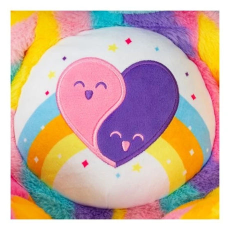 Close-up of the Care Bears Friends Forever Bear embroidered tummy badge showing two interlocking pink and purple smiling hearts on a white and rainbow striped background with star details