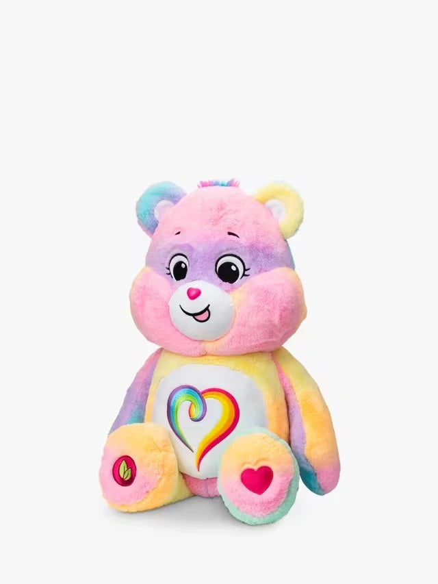 Care Bears Jumbo Plush Togetherness Bear seated front view showing full pastel rainbow body, rainbow heart tummy badge and embroidered facial features