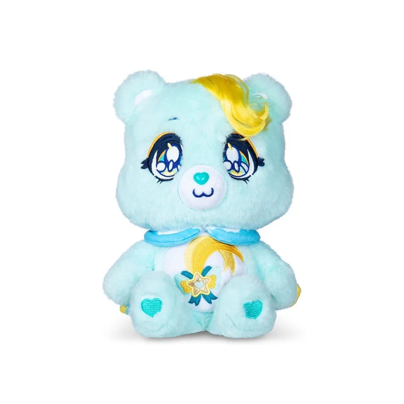 Front view of Care Bears Kindness Keepers Wish Bear showing turquoise fur, embroidered anime style eyes, yellow curled fringe, blue collar and decorative shooting star belly badge.