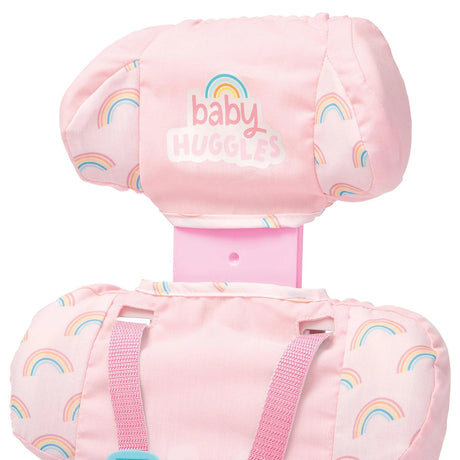 Casdon Baby Huggles Booster Seat close-up showing the pink Baby Huggles adjustable headrest and rainbow print seat