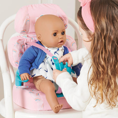 Casdon Baby Huggles Booster Seat close-up with doll secured by the pink harness and teal hand buckle