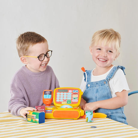 Two children playing with Casdon Cash Register and food accessories at table – Ireland