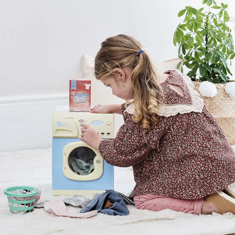 Child using Casdon Electronic Washer toy and detergent box – Ireland