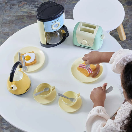 Overhead view of the Casdon Morphy Richards Kitchen Set with kettle, toaster, coffee maker, cups, plates and play food