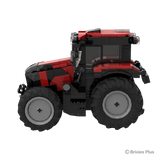 Side view of the BRIXIES Plus Case Puma 175 showing the red bodywork, enclosed cab, exhaust stack and different sized agricultural tyres