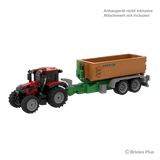 BRIXIES Plus Case Puma 175 connected to a Joskin trailer to demonstrate attachment compatibility, with the attachment marked as not included