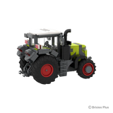 Rear left view of the CLAAS AXION 9450 BRIXIES model showing the rear linkage, cab, mudguards and large rear tyre