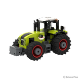 CLAAS AXION 960 BRIXIES tractor viewed from the front left showing the grey front weight, green bonnet, cab and red rimmed wheels