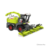 Front angled view of the BRIXIES Plus CLAAS JAGUAR 1200 showing the wide maize header with multiple intake units, cab and large front wheels