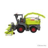Right side view of the BRIXIES Plus CLAAS JAGUAR 1200 with the wide maize header, raised discharge spout, cab and large agricultural tyres visible