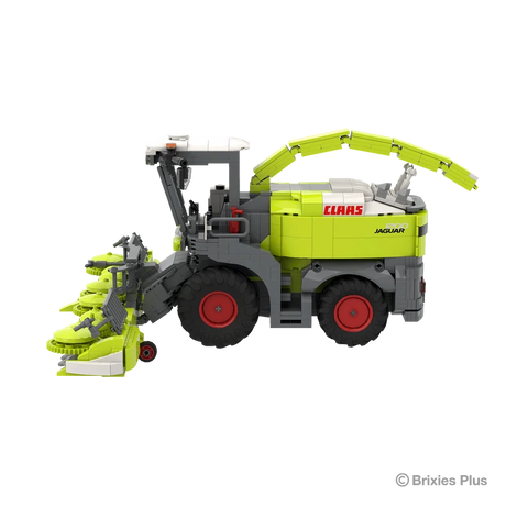 Right side view of the BRIXIES Plus CLAAS JAGUAR 1200 with the wide maize header, raised discharge spout, cab and large agricultural tyres visible