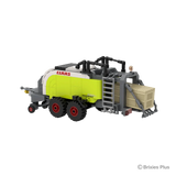 Rear right view of the BRIXIES Plus CLAAS QUADRANT 5300 FC showing the bale chamber, ladder, rear frame and twin axle running gear