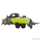 BRIXIES Plus CLAAS QUADRANT 5300 FC in side profile showing the lime green baler body, tandem red rimmed wheels, pickup housing and rear bale chamber