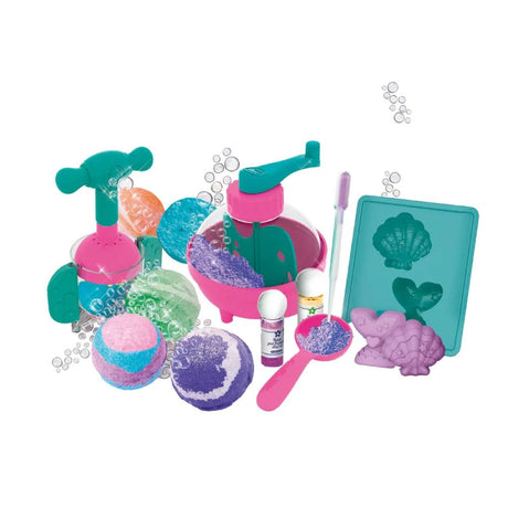 Colourful pink, purple, blue, green and orange bath bombs displayed with turquoise and pink mixing equipment, a mould tray with seashell and heart shapes, two small bottles and a pink measuring spoon.