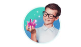 Boy wearing black glasses and a pale blue polo shirt, smiling while holding a cluster of bright pink crystals against a turquoise circular background.