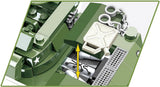 Close-up of COBI H.M.C M8 Scott engine compartment with yellow movement arrow