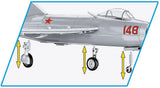 COBI MiG-15 Fagot landing gear components with yellow vertical arrows