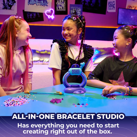 Three children around the Cool Maker KPop Demon Hunters bracelet studio with loose beads on the table