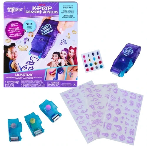 Cool Maker KPop Demon Hunters Shimmer Me Tattoo kit with purple retail packaging featuring Rumi, Mira and Zoey, a purple HUNTR/X foil roller, three turquoise foil cartridges, purple tattoo design sheets and colourful adhesive gems.