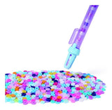 Purple Cool Maker beading pen positioned above a pile of multicoloured Heishi beads