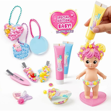 Creamy Deco special edition baby doll with pink and yellow hair decorated with miniature fruit slices and pearls, displayed alongside decorated keychains, hair clips, three cream tubes and a Special Edition Baby graphic.
