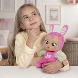 Child holding Cry Babies Meal Time Julie doll, demonstrating her crying feature and light up tears.