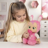 Child interacting with Cry Babies Meal Time Julie doll using her matching dummy accessory.