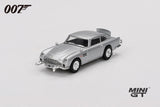 Mini GT James Bond Goldfinger Aston Martin DB5 silver RHD model viewed from the front left showing the chrome grille, front bumper details and wire style wheels