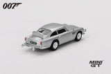James Bond Goldfinger Aston Martin DB5 silver RHD model viewed from the rear showing the tail lights, chrome bumper, exhausts and rear body shape