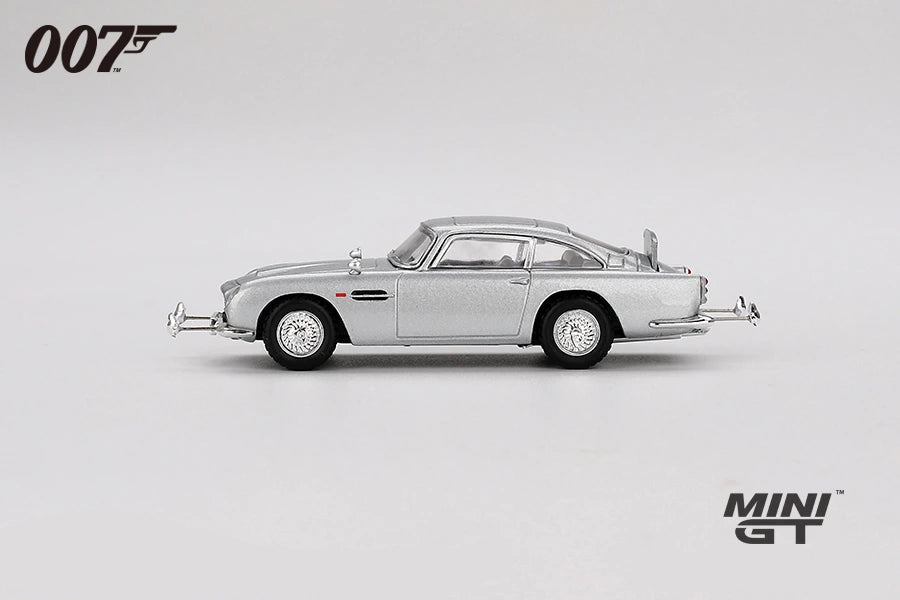 Silver Aston Martin DB5 from Goldfinger shown in full side profile with chrome trim, wire style wheels and extended bumper details