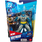 Mattel DC Batman action figure in blue and grey inside its blue blister packaging, with Batman artwork on the left, a yellow utility belt, blue cape and Batman name printed across the bottom.