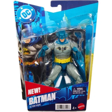 Mattel DC Batman action figure in blue and grey inside its blue blister packaging, with Batman artwork on the left, a yellow utility belt, blue cape and Batman name printed across the bottom.