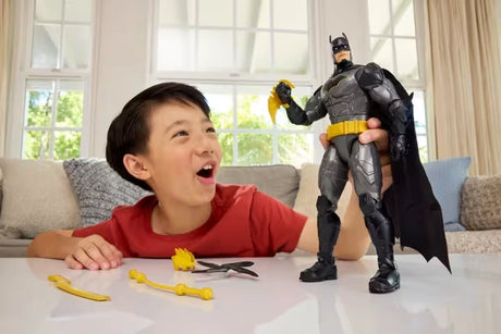 DC Premier Crime Crusher Batman standing with weapons beside a child at a table