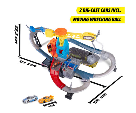 Fast & Furious Wrecking Crash Course overhead product graphic showing the assembled track dimensions of 91 cm by 56 cm and 38 cm high, with two diecast cars.